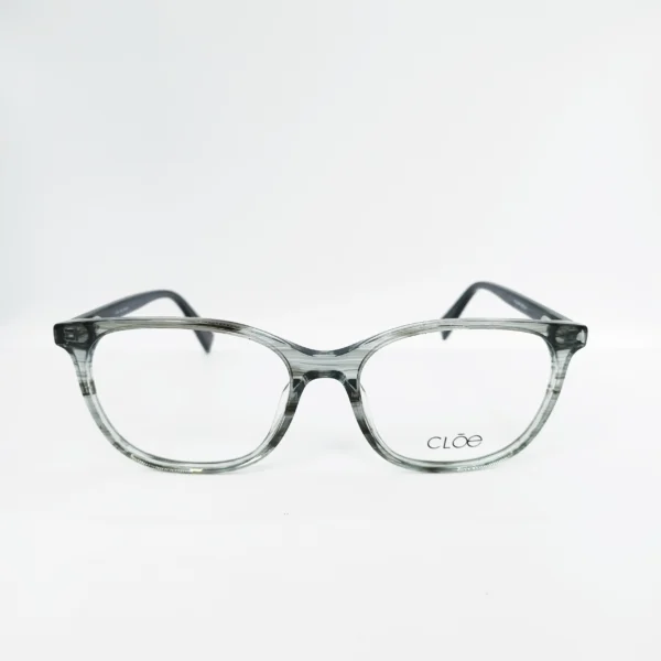 1-24.webp Lente oftálmico Cloé de transparencia gris con varillas estampadas.